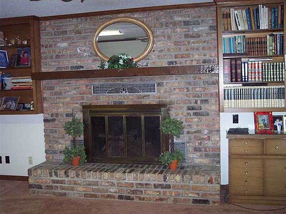 Brick woodburning fireplace.