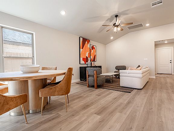 Living dining areas in the Paisley, one of Betenbough s homes with two car garage.