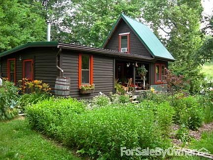 Back of House and Herb Garden
						:
						Gardens watered with Oak Bourbon barrels that catch overflow water off of roof.