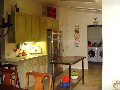 View of Kitchen and Laundry Room Area.