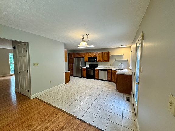 Bright and open kitchen with new countertops and sink