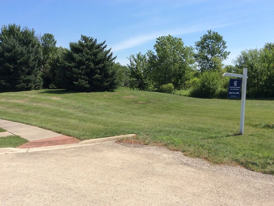 A Berm surrounds the property on 3 sides; already has mature evergreens planted and grass growing. S