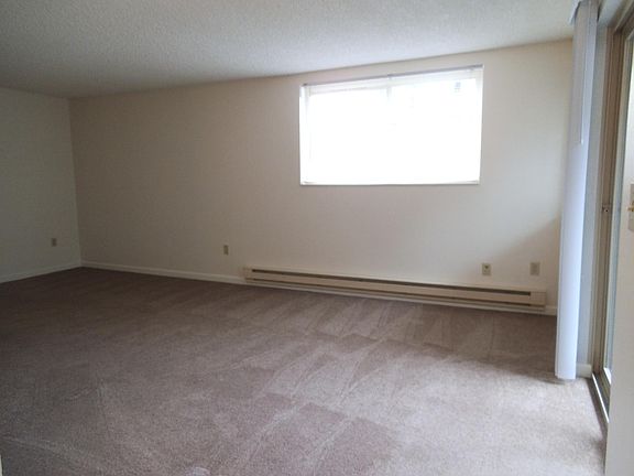 large living space with sliding glass doors to patio