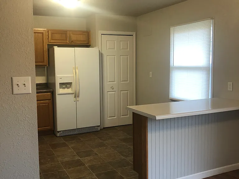 Please note: photos were taken prior to renovation. New luxury vinyl plank flooring, fresh paint throughout, new stainless steel appliances, and a new peninsula countertops are currently being installed.
