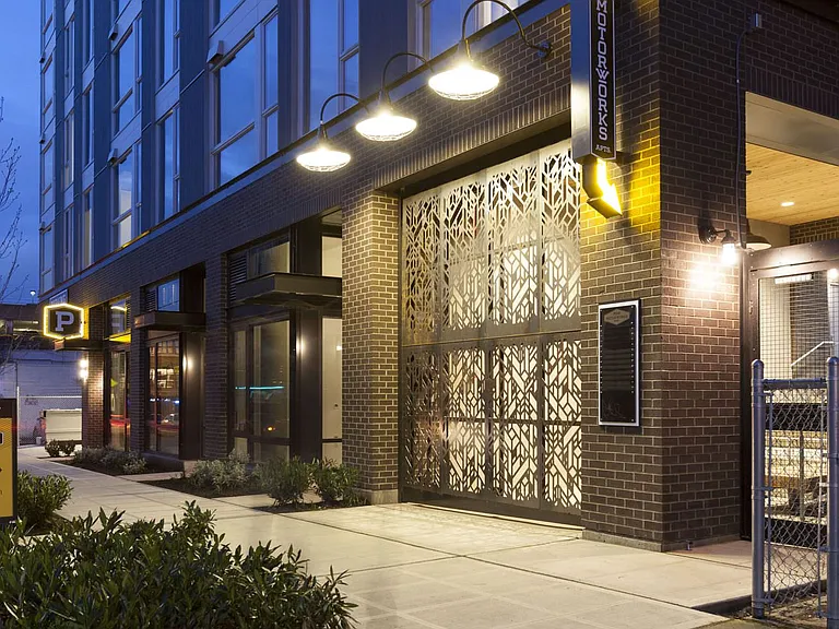 Property Entryway with Signage and Modern Architectural Lighting