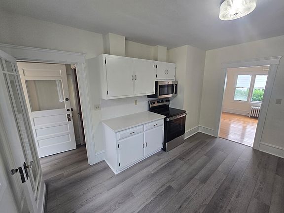 Kitchen with new stove and microwave
