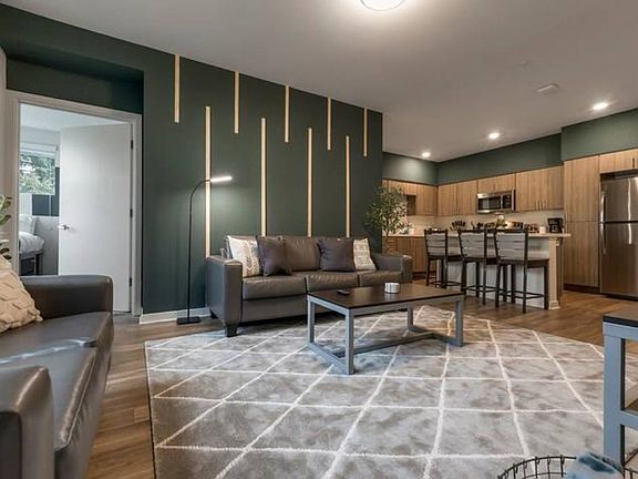 Kick back in the living room and watch a program on the 55" Smart TV. This is a shared space with your roommates.