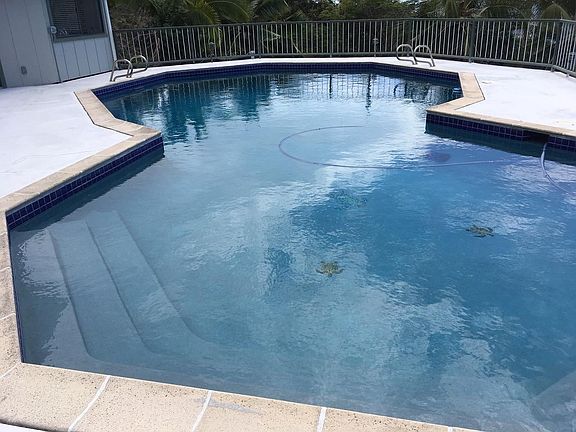 Sparkling resurfaced pool (8' 8" deep), secure deck & 3rd full bathroom