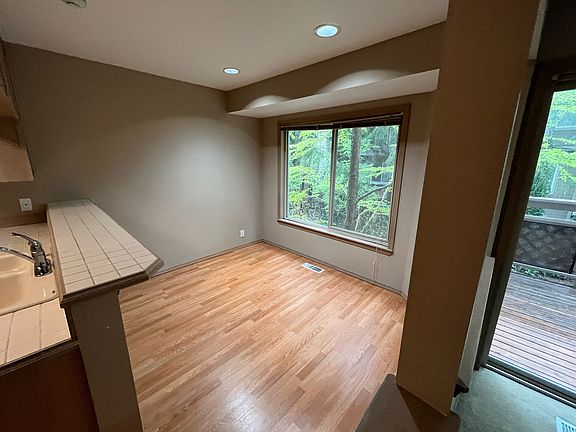 Dining room with a large window.