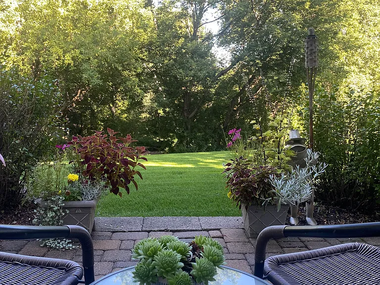 Patio with fire pit looking out to the yard and 30 acres of nature preserves with paths and fire ring/seating area. The woods have rugged paths that you're welcome to use if you're up to it. Grab a blanket and a bottle of wine !