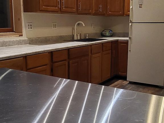Kitchen showing custom bar-height table
