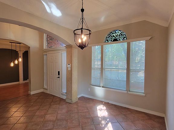 Formal Dinning Room/Family Room Facing Entry Way and Office.
