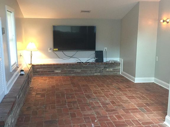 Living room with flat panel TV; cable installed