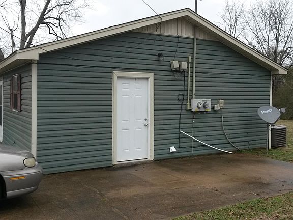 Side View showing Kitchen Door & Parking Pad