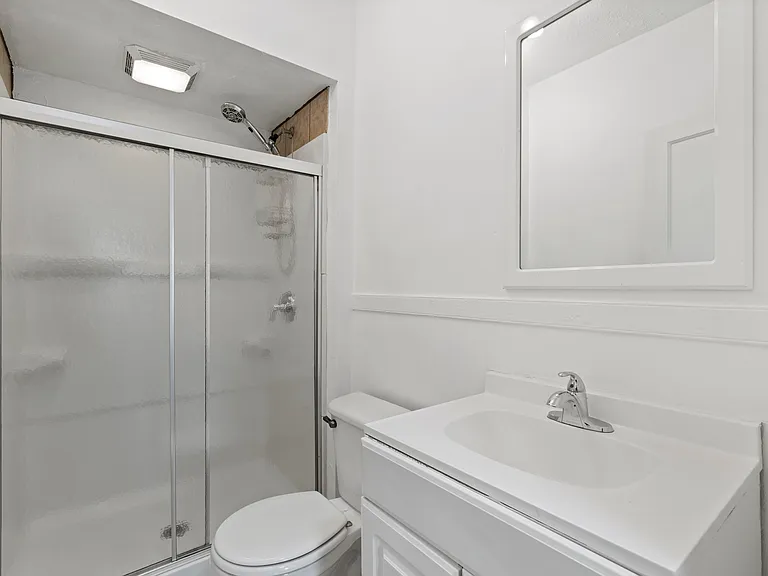 Full Bath. Shower with glass sliding doors.