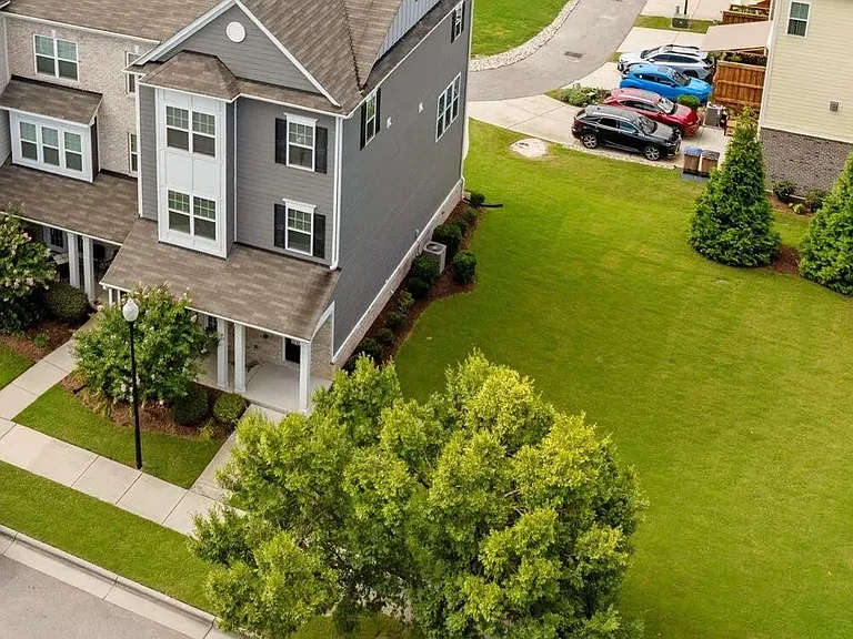 This is an end unit with a large grassy area.