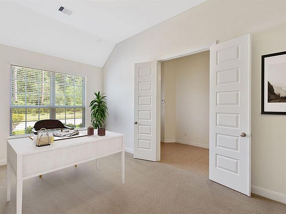 Dedicated study with French doors located just off the entry. Plenty of natural light and privacy. (virtually staged)