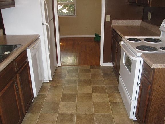 Kitchen nestled in between dining area and living room.