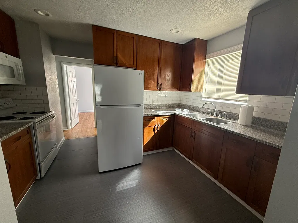 Updated 3-Bedroom, 1-Bathroom, Aurora Home with Private Yard & Parking — Photo 2
