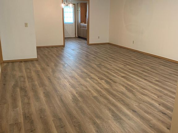 From Front Door showing Great Room, Dining Room, and into Kitchen
