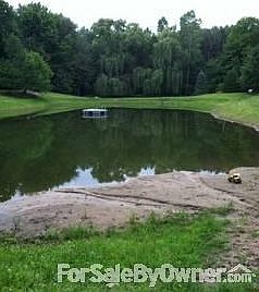 Pond
						:
						Open floor plan with kitchen, dining, and living room combined