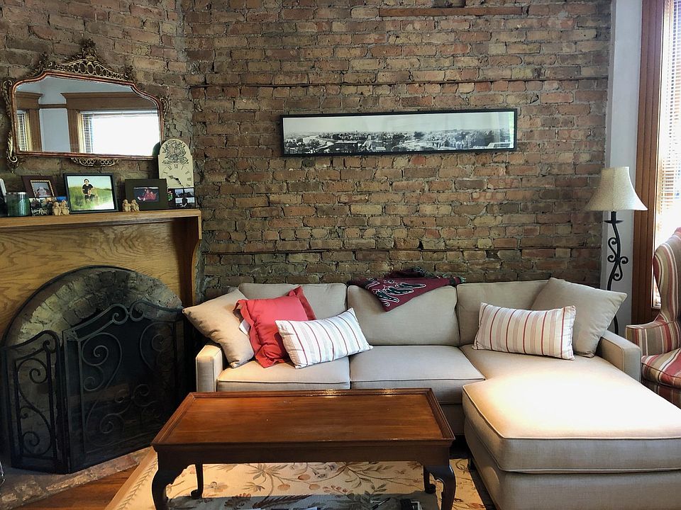 Living room with exposed brick and new direct vent fireplace!