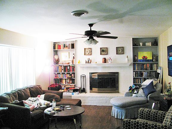 Living room w/fireplace and shelves