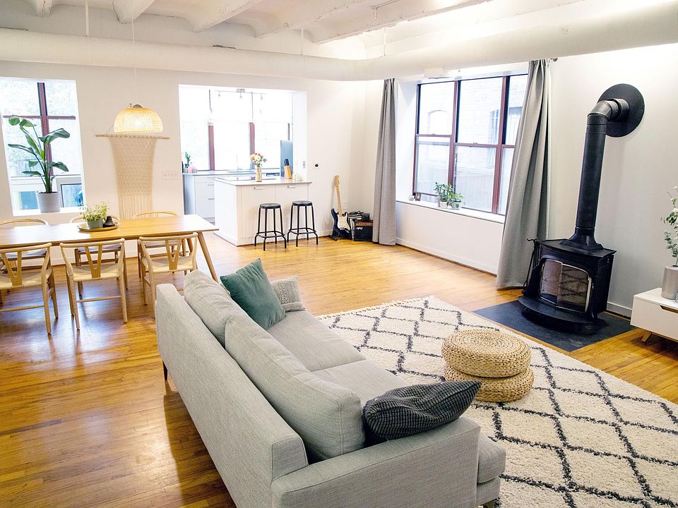 Living room with 12' ceilings and working fireplace.