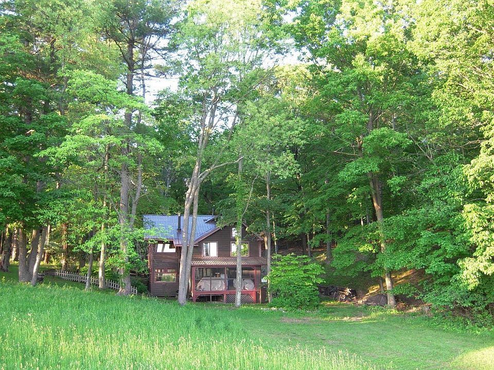 Your country hideaway borders a pristine meadow with surrounding garden views, upstairs distant views, and stunning evening views from atop an adjoining knoll.