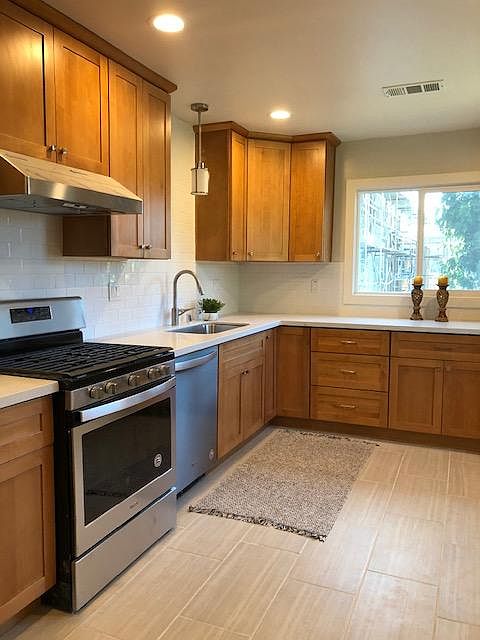 Spacious eat-in kitchen, bright natural light. All new! Maple shaker cabinets, quartz counter, white subway tile, stainless steel appliances including gas stove, dishwasher, refrigerator. Look at the natural light!