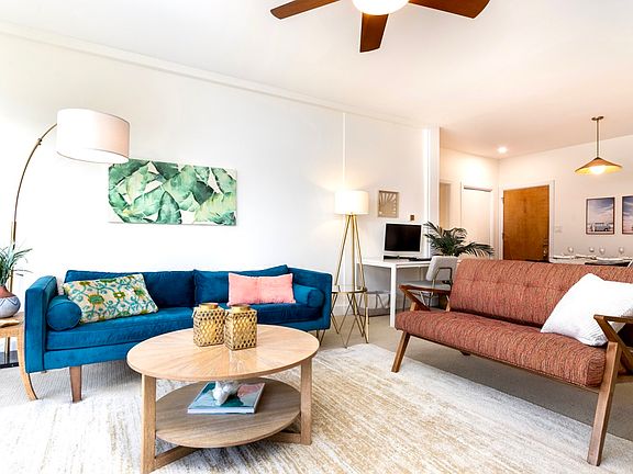 Modern coastal living room with West Elm seating and abundant natural light