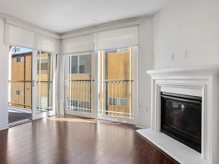 Living Room with Electric Fireplace, Patio with Window Shades