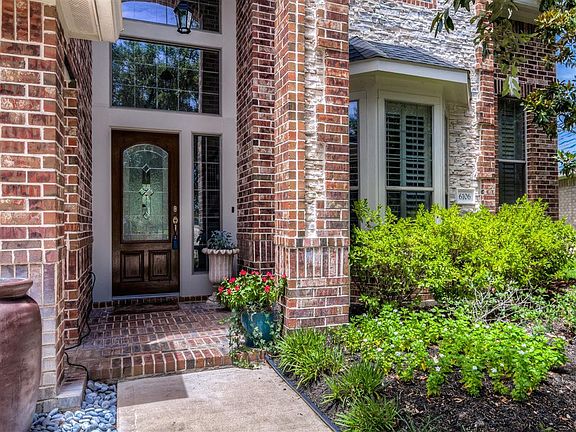 A bricked front porch welcomes you and guests.