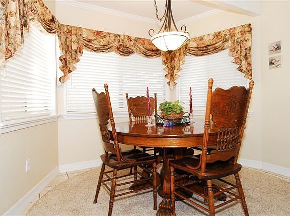 Dining area with side yard views