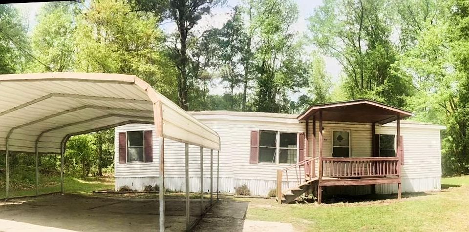 Beautiful home that includes large paved, car port!