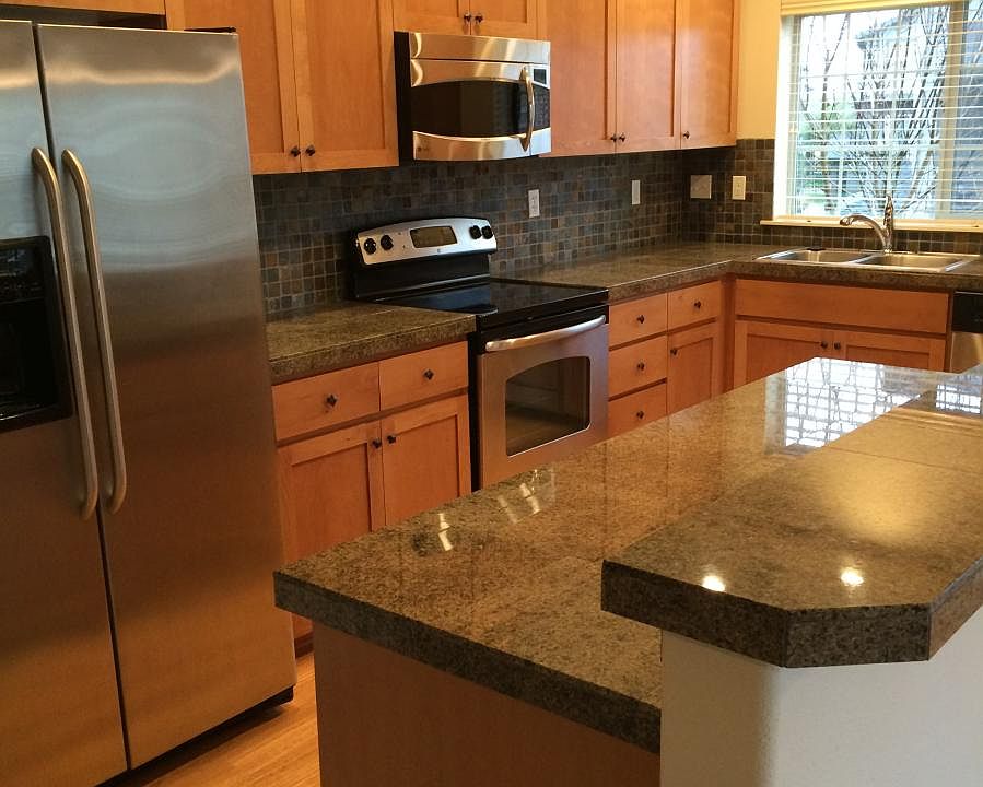 Full tiled backsplash in kitchen