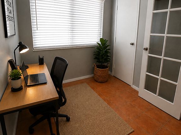Downstairs flex room, ideal for office, study or bonus space - shown as office. New dual-pane solar-tinted windows.