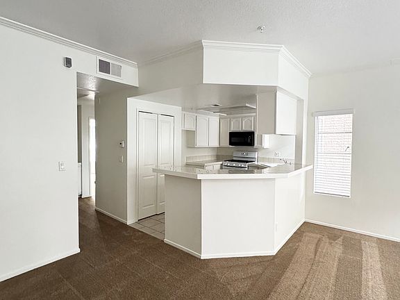 Entry showing living, dining, kitchen