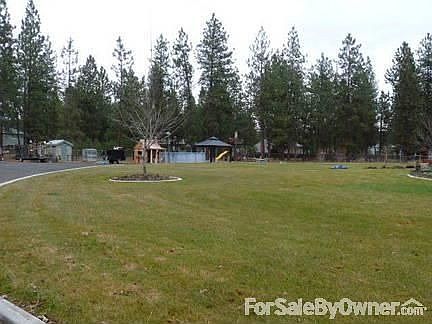 Bk yd
						:
						Lg fncd bk yd w/curbs,spr sys,gd spot,kids play area, horse shoes