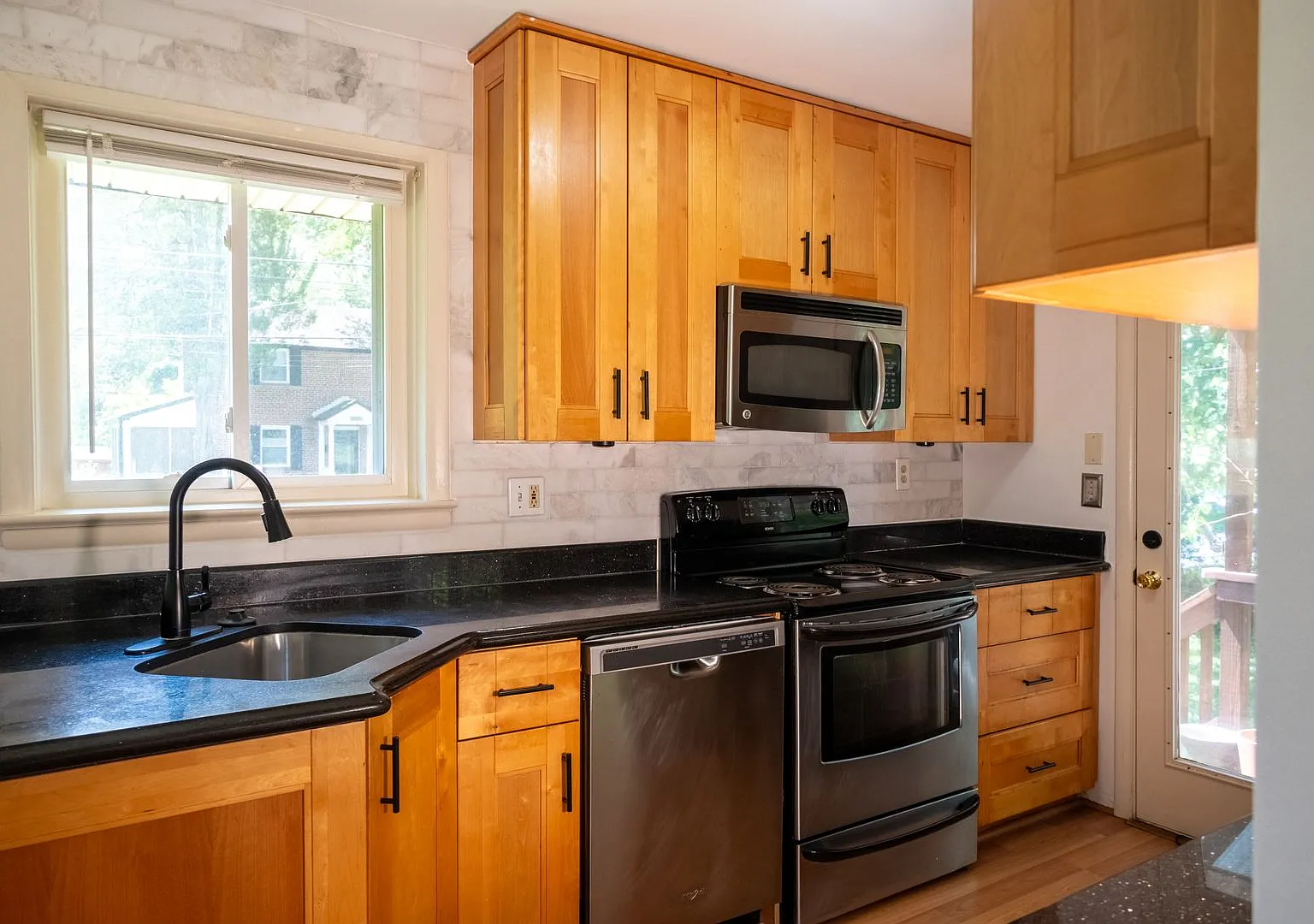 Charming Split-Level Home with Bright Interiors and Spacious Backyard — Photo 2