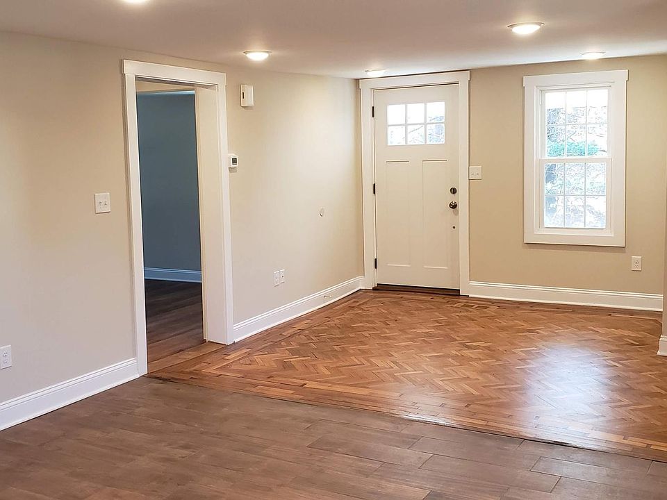 Living room. Front door on porch. Open to dining & kitchen