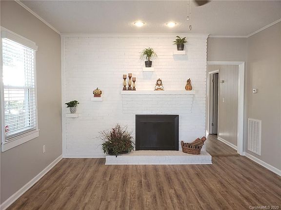 Cozy living room with brick accents.
