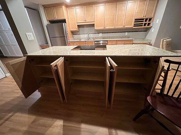 Granite Island has new glass-top stove and lots of storage!