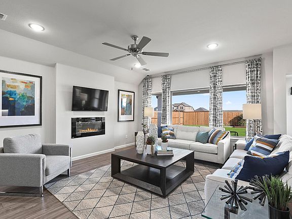 Living room in the Oscar home plan by Trophy Signature Homes - REPRESENTATIVE PHOTO