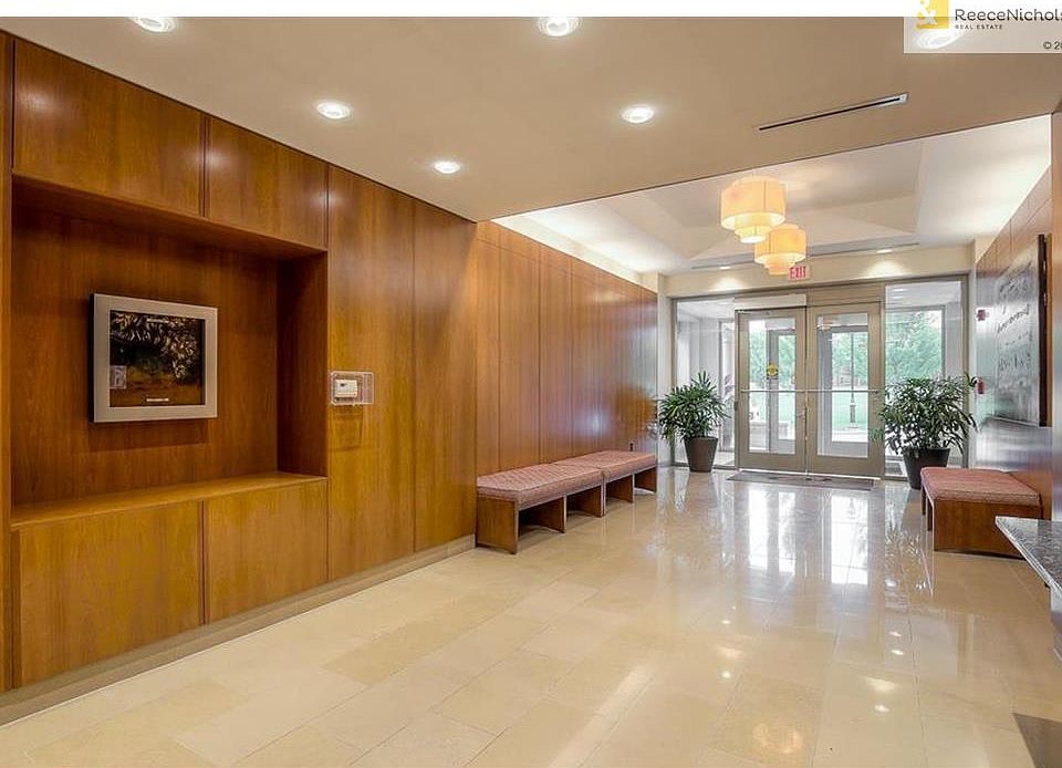 This immaculate lobby impresses with wood and marble.