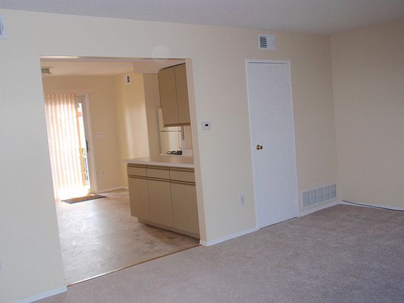 Living room open to kitchen-dining area