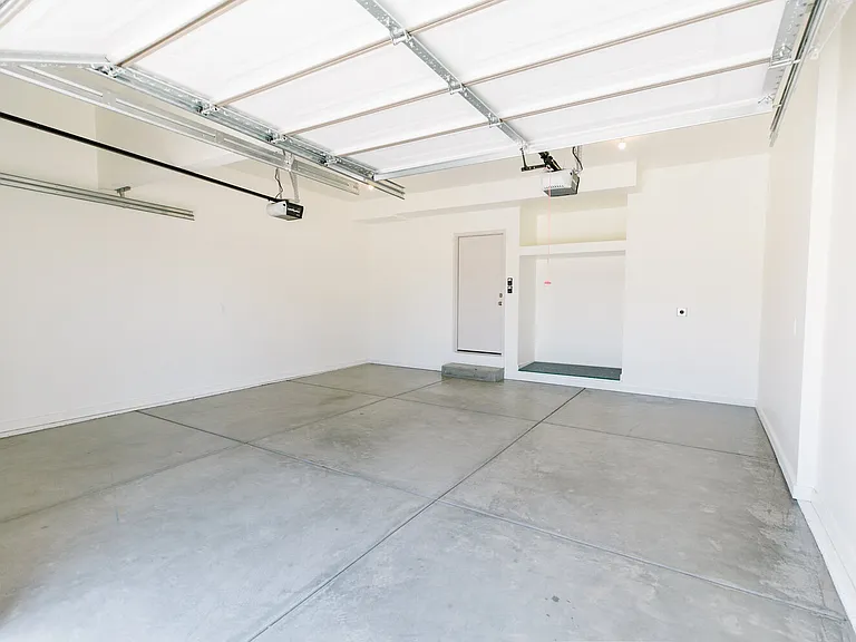 2 car garage is fully finished with available car charging port