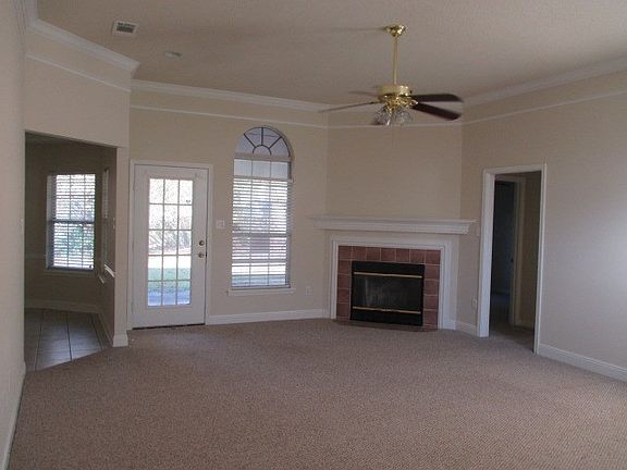living room view from front door, dining area on left