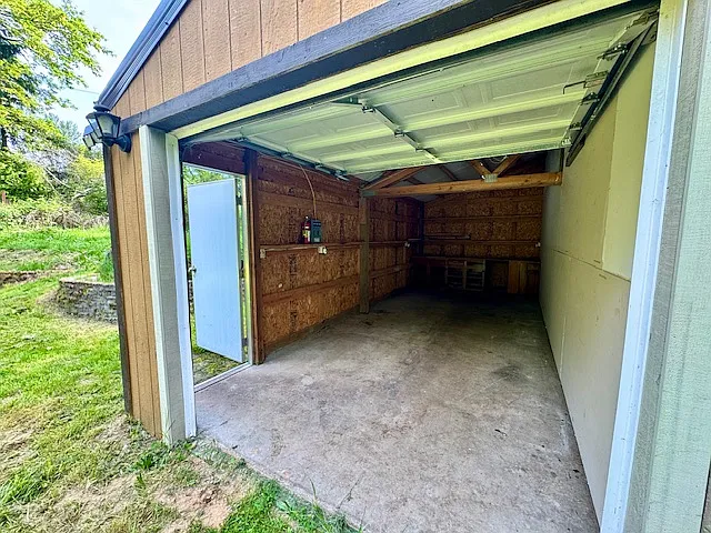 Deep 1 Car Garage with work bench.