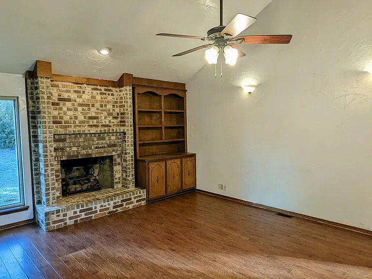 Lovely fireplace and built-in cabinets.